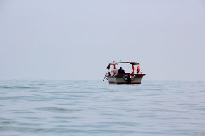 Silhouette of person on boat in sea