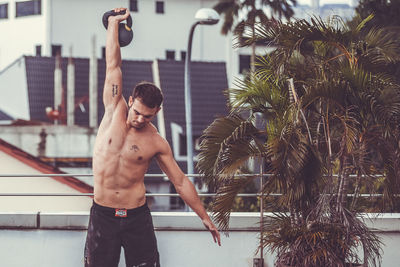 High angle view of shirtless man in swimming pool