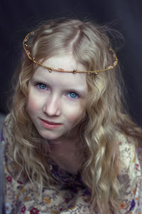 Close-up portrait of girl wearing tiara