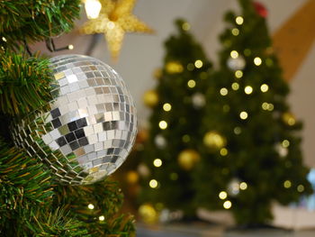 Close-up of disco ball on christmas tree