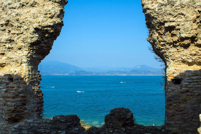 Scenic view of sea against blue sky
