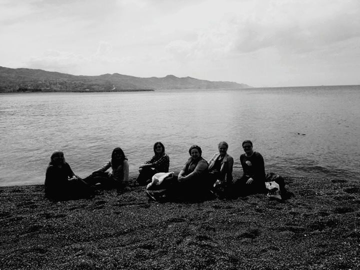 water, men, sky, lifestyles, leisure activity, sea, togetherness, sitting, person, relaxation, beauty in nature, nature, tranquility, scenics, tranquil scene, mountain, vacations, lake, beach