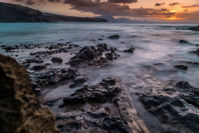 Scenic view of sea against sky during sunset