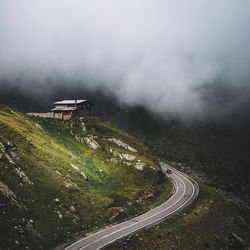 High angle view of road amidst mountains against sky