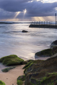 Scenic view of sea against sky at sunset