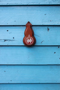 Close-up of red umbrella on wood