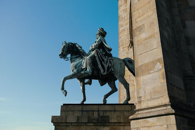 Low angle view of statue against sky