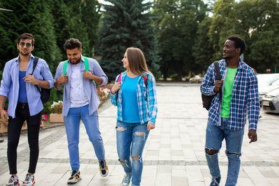 Group of people walking on footpath