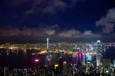 Aerial view of city lit up at night