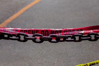 High angle view of chain on road