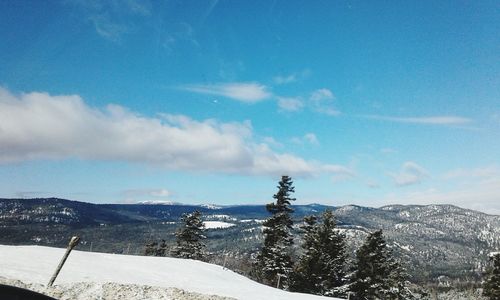 Scenic view of snowcapped mountains against sky