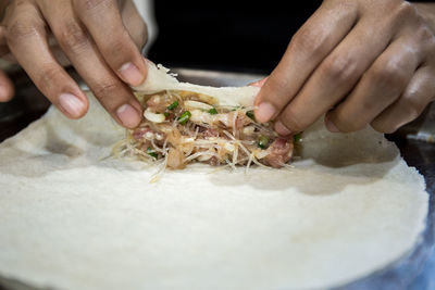 Midsection of man preparing food