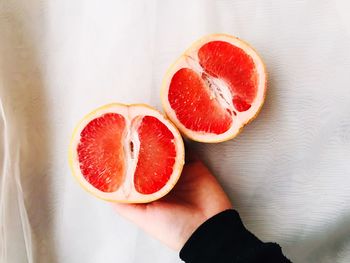 Close-up of hand holding strawberries