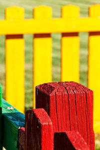 Close-up of red wooden fence