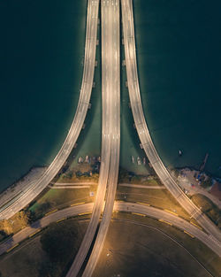 High angle view of light trails on highway at night