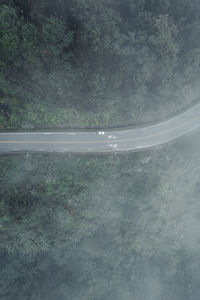 High angle view of road seen through glass window