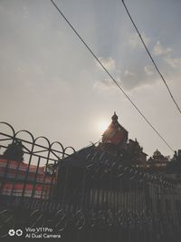 Low angle view of buildings against sky during sunset