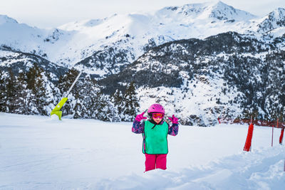 Young skier, girl having fun on the snow. winter ski holidays in andorra