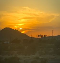 Scenic view of silhouette landscape against sky during sunset