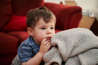 Portrait of a cute young boy and his safety blankie