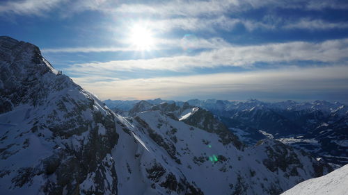 Scenic view of snowcapped mountains against sky