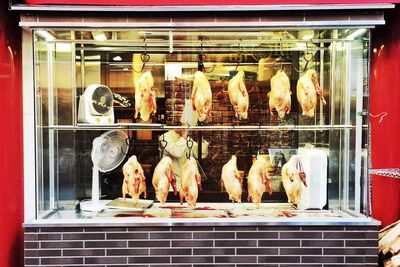 Cooked chickens displayed in cabinet