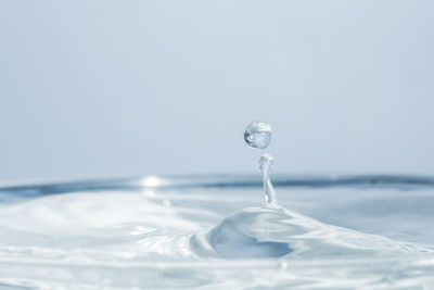 Close-up of drop splashing in water