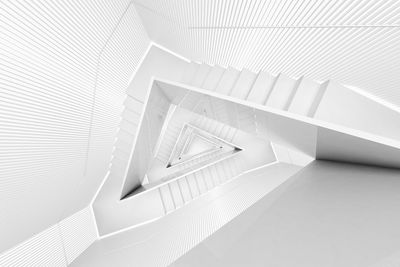 Directly above shot of white spiral staircase in building