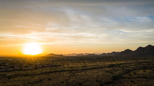 Scenic view of landscape against sky during sunset