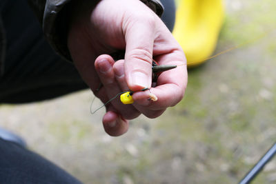 Close-up of hand holding ice cream