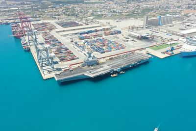 High angle view of commercial dock against blue sky