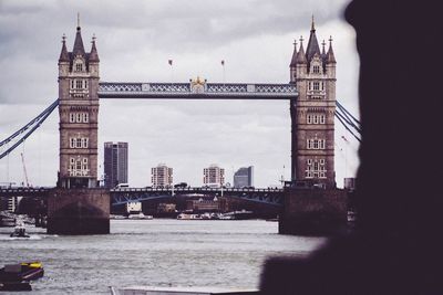 View of bridge over river with buildings in background