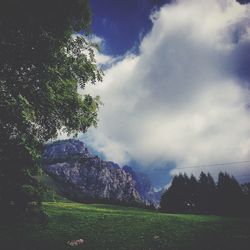 Scenic view of landscape against cloudy sky