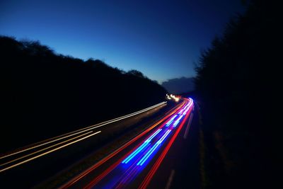 Light trails on road at night