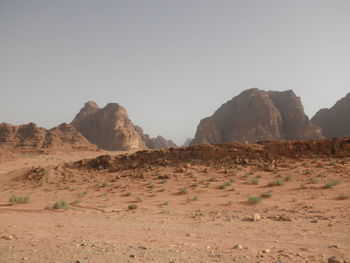 Rock formations in desert against clear sky