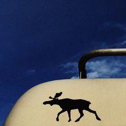 Horse cart on snow against sky