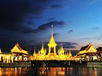 Illuminated temple against sky at night