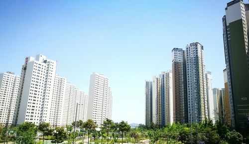 Low angle view of buildings against clear sky