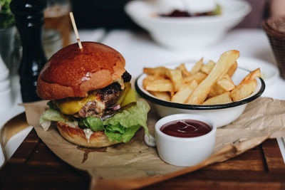 Close-up of burger and vegetables on table