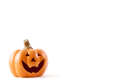 Close-up of jack o lantern against white background