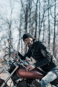 Man riding motorcycle on tree