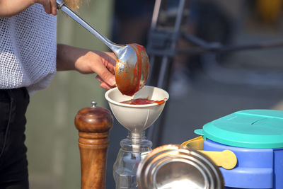 Mid section of a man preparing food