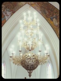 Low angle view of illuminated chandelier