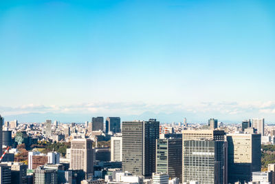 Modern buildings in city against sky