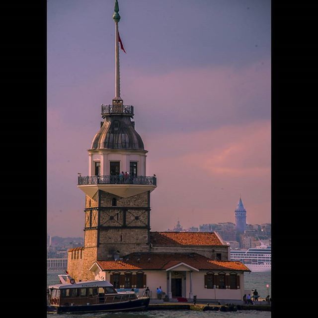 architecture, building exterior, built structure, sky, city, residential building, residential structure, cloud - sky, tower, building, cityscape, place of worship, house, sunset, religion, residential district, outdoors, dome, church, travel destinations