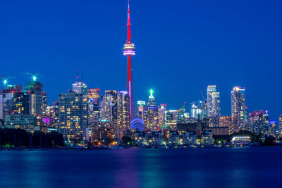 Illuminated buildings in city at night