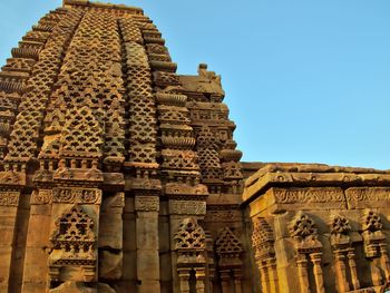 Low angle view of temple against blue sky