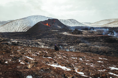 Scenic view of volcanic mountain against sky