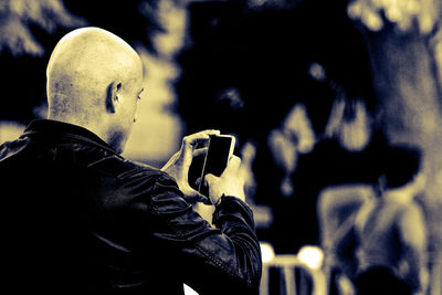 Close-up of man using mobile phone