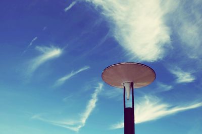 Low angle view of lamp post against blue sky